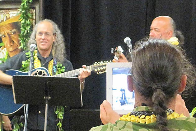 Pili with Kumu Pekelo Day and the back of judge Mark Keali&lsquo;i Ho&lsquo;omalu's head